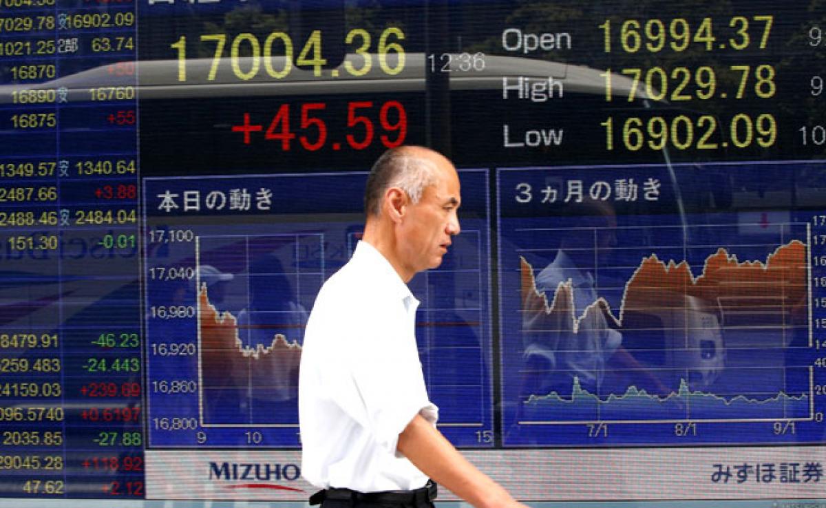 Asian stocks slip as caution sets in; debt yields firm